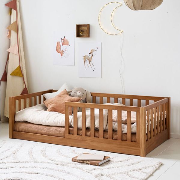 Toddler floor bed Nid in walnut wood finish measuring 70x140 cm from Petite Amélie