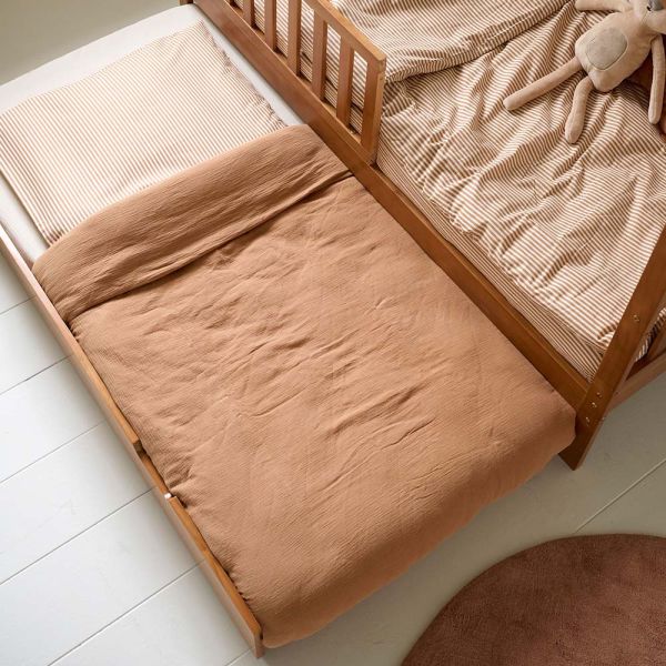 Kids trundle bed in walnut with dimensions of eighty by one hundred sixty centimeters from Petite Amélie