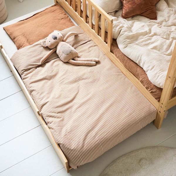 Kids trundle bed in natural wood finish with dimensions of eighty by one hundred sixty centimeters from Petite Amélie